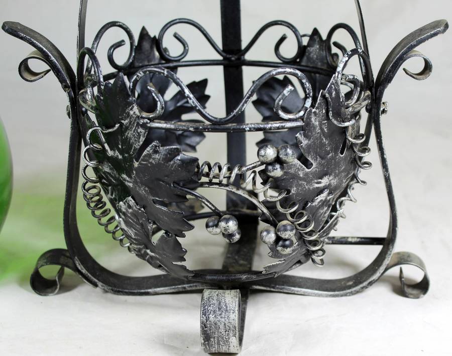 Large metal swing with green decanter
