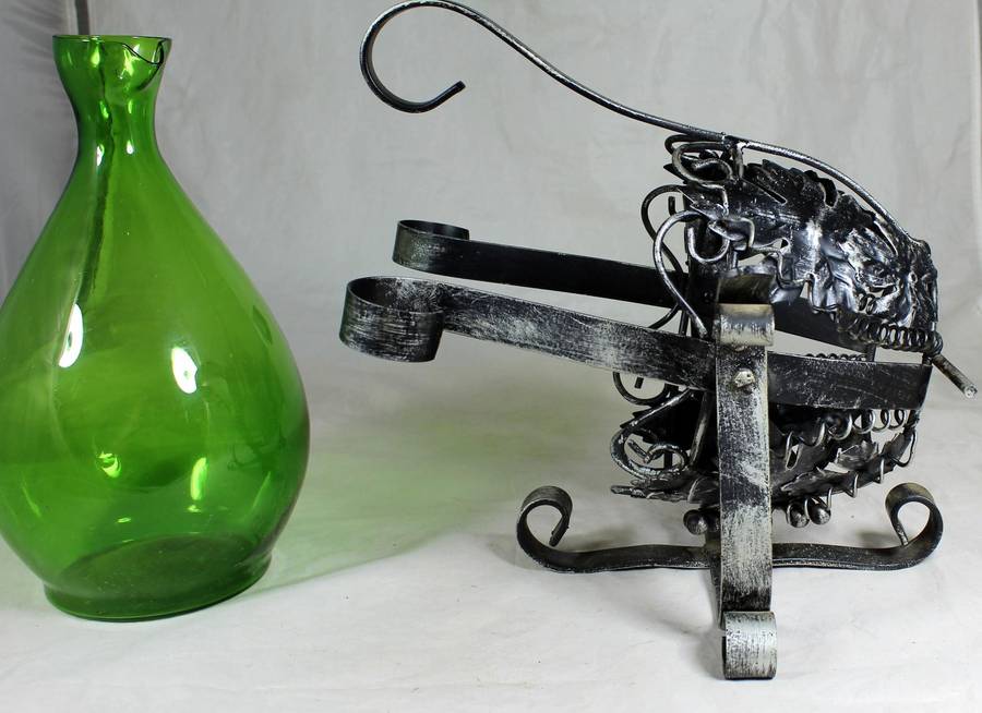 Large metal swing with green decanter