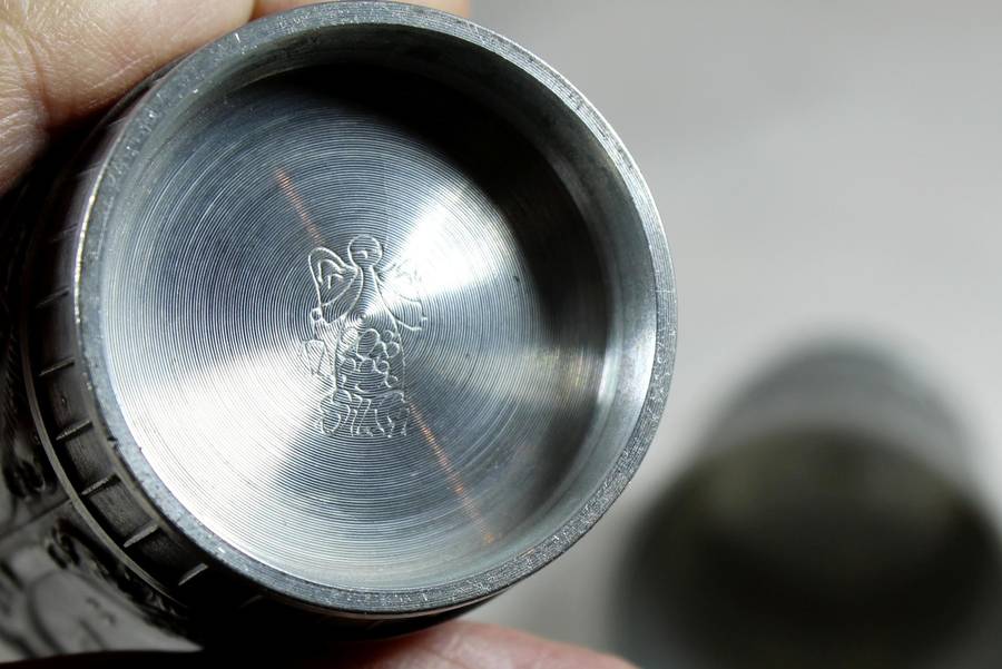 Pair of embossed pewter drinking cups