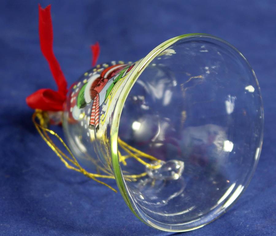 Small glass bell with kids in the snow