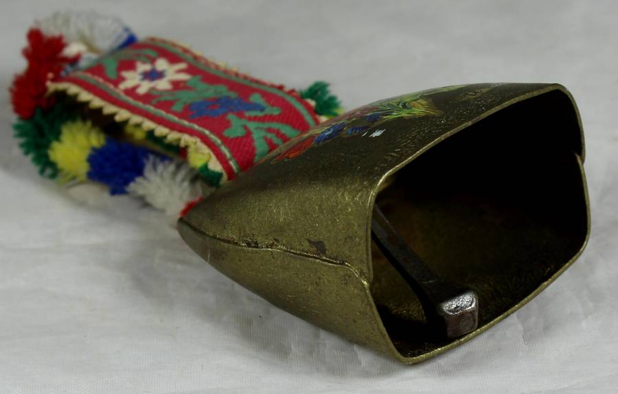 Cow bell with decorative strap