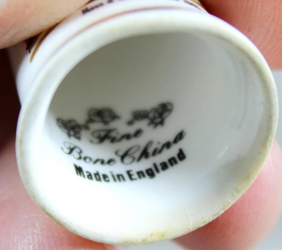 Bone China thimble - Moss & Woodd "Orion" 1905