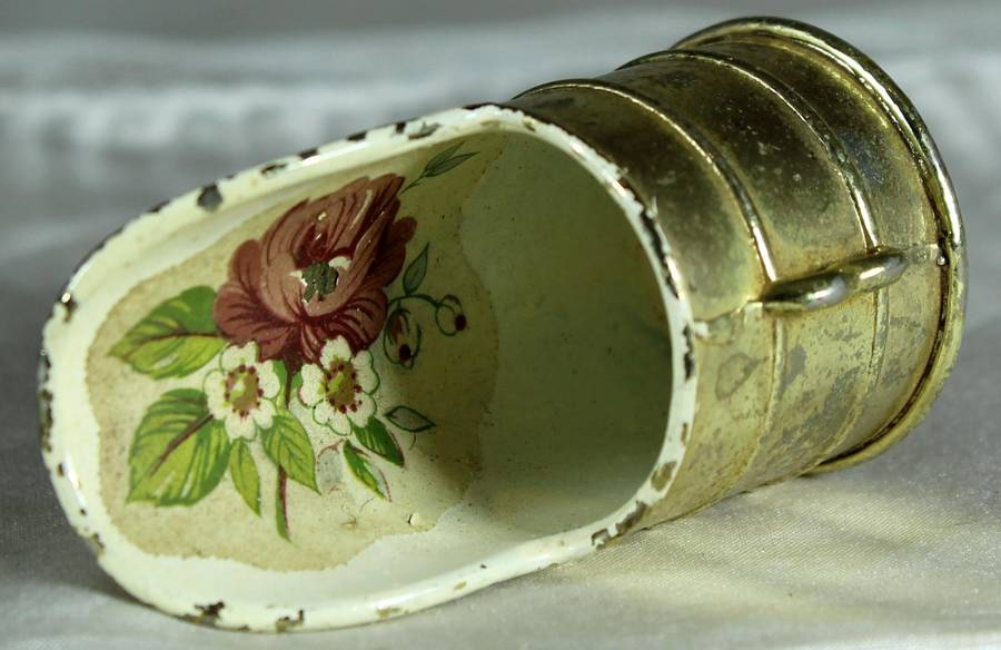 Miniature brass and porcelain shuttle
