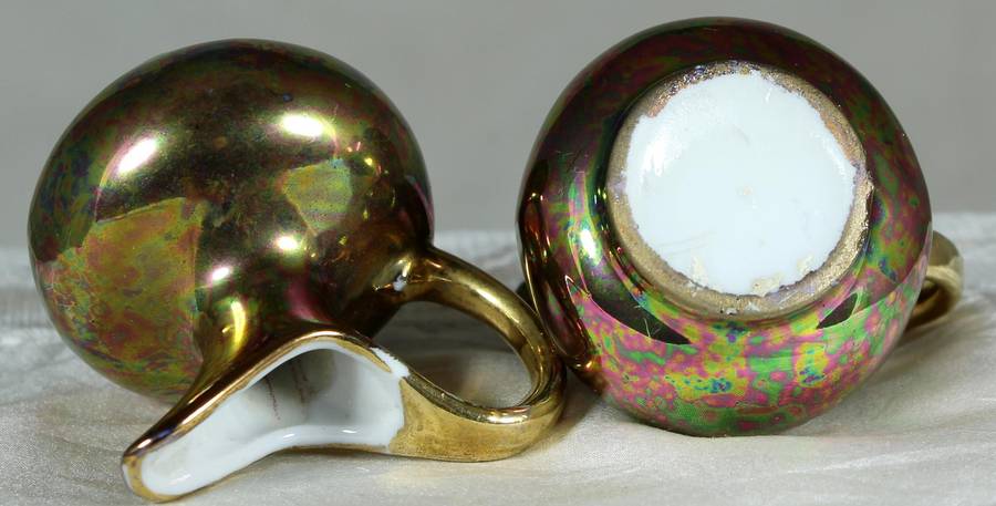Miniature pair of golden covered pitchers