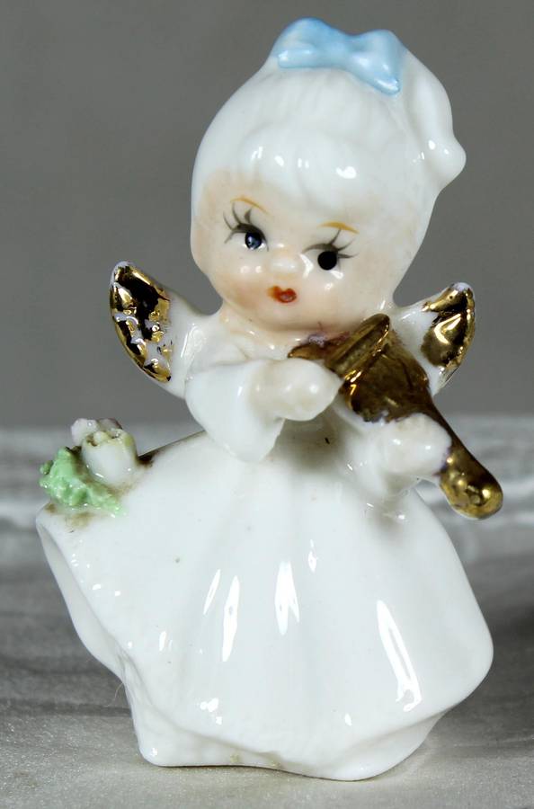 Miniature angel playing a violin