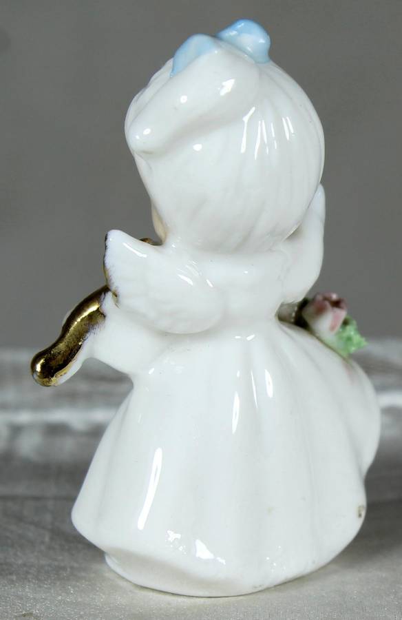 Miniature angel playing a violin