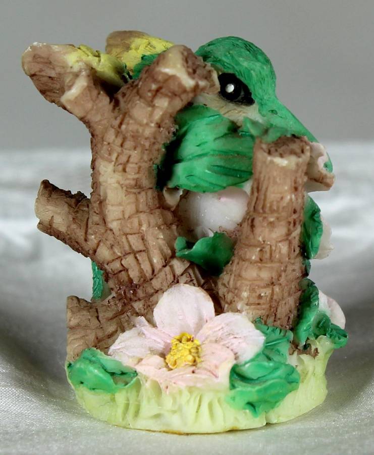 Miniature humming bird on flowers