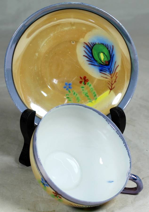 Small porcelain duo with peacock feathers