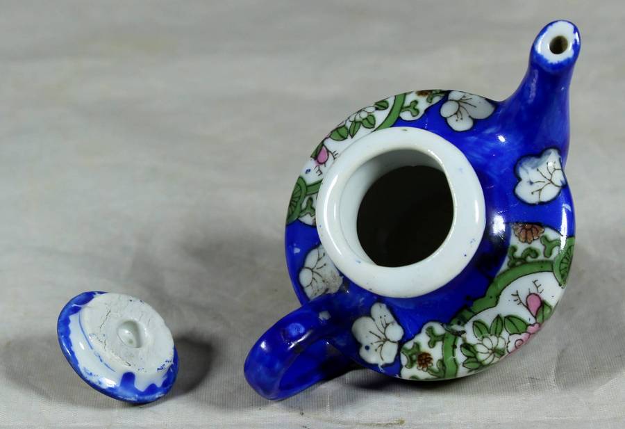 Miniature blue kettle with flowers
