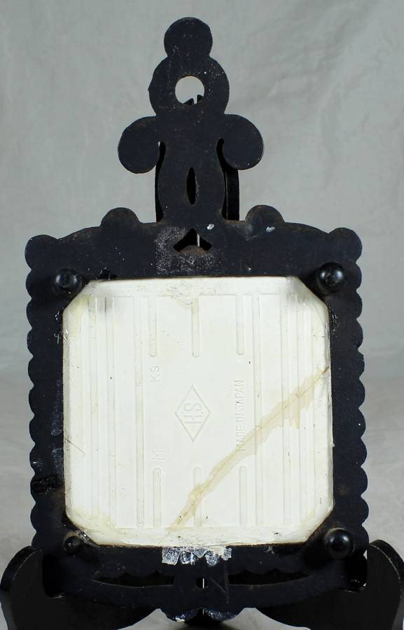 Pot stand with ornate cast-iron plus tile