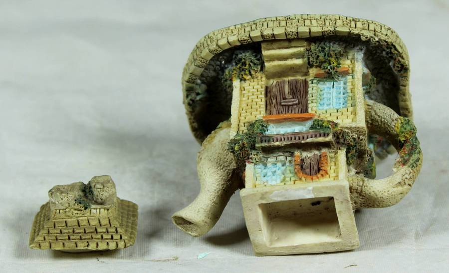 Miniature ornamental house in the shape of a tea kettle