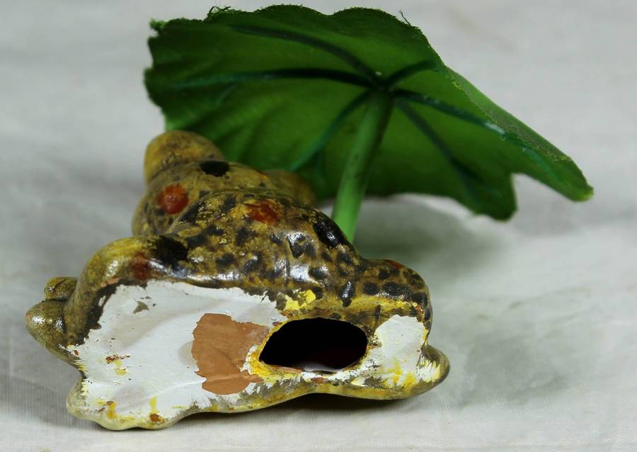 Ceramic frog holding a leaf umbrella