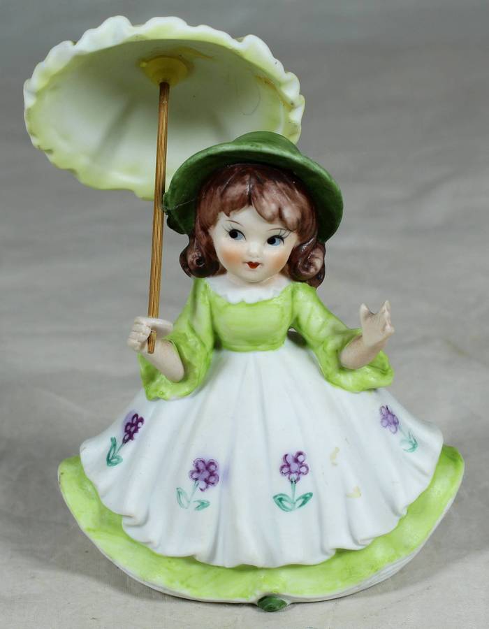 Ceramic country girl holding a parasol