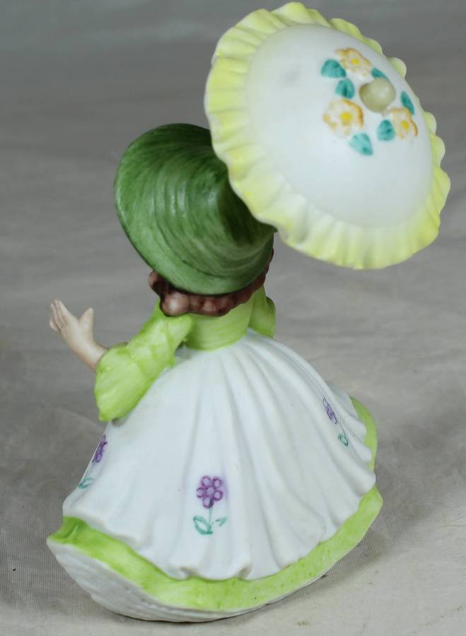 Ceramic country girl holding a parasol