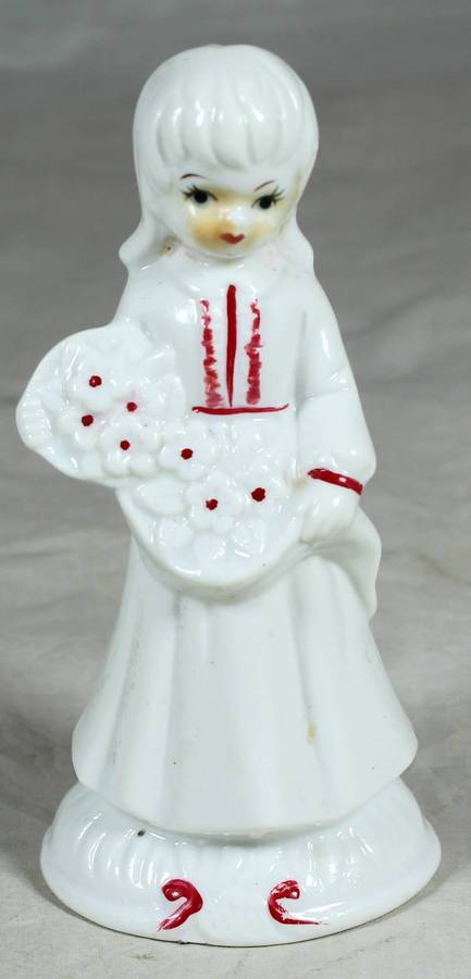 Glazed ceramic girl in a white dress