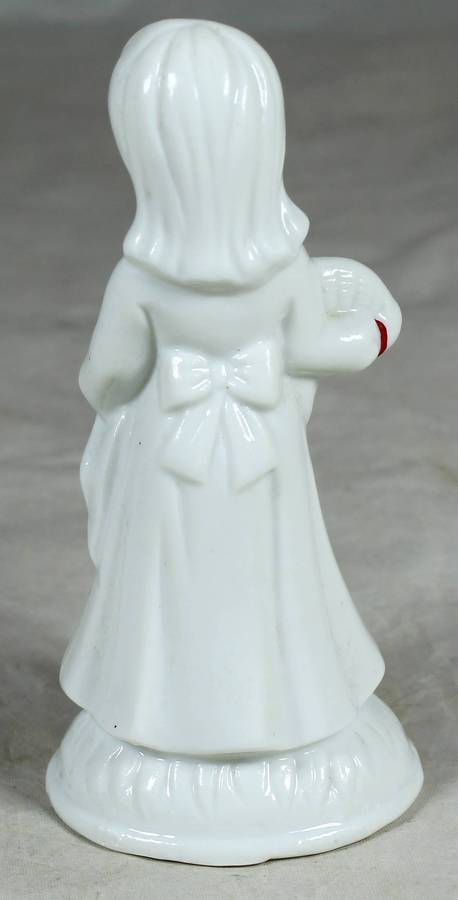 Glazed ceramic girl in a white dress