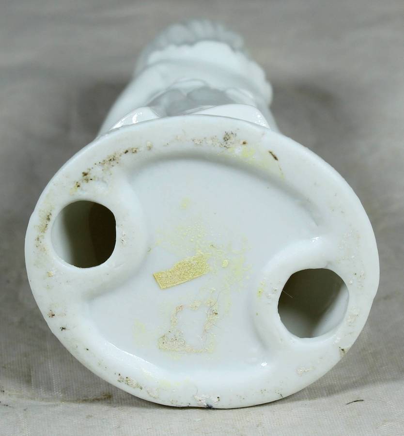 Glazed ceramic girl in a white dress