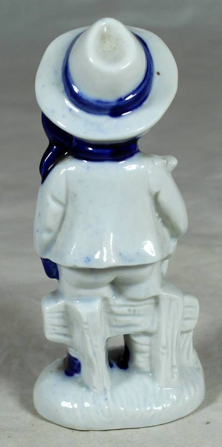 Ceramic boy holding a bunny