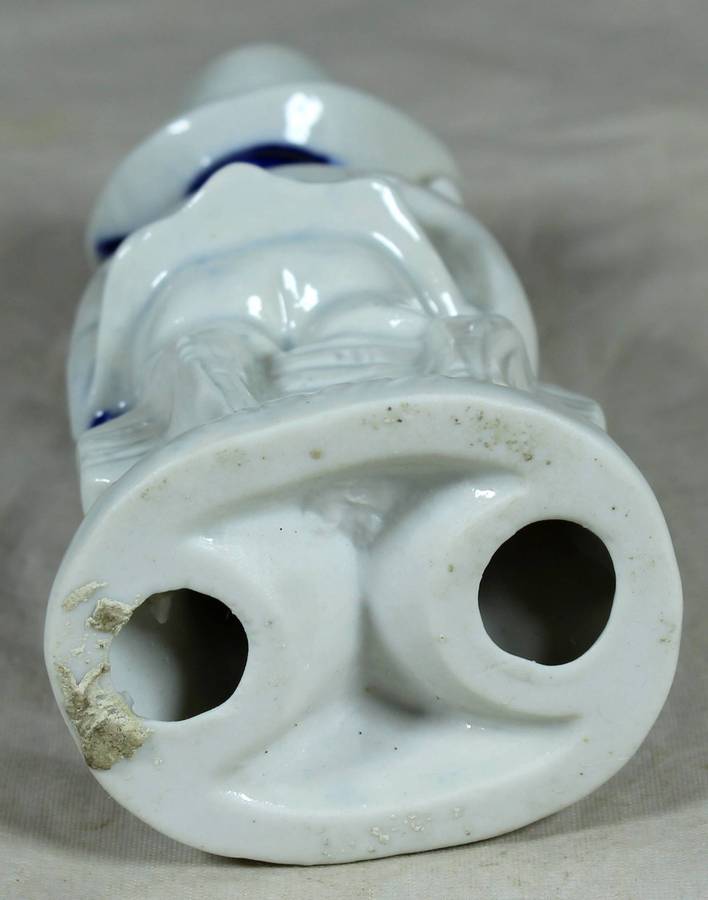 Ceramic boy holding a bunny