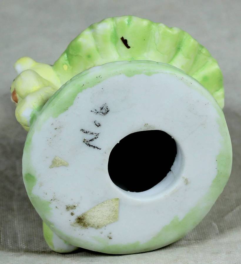 Ceramic figurine - Bear ballerina with green dress, seated