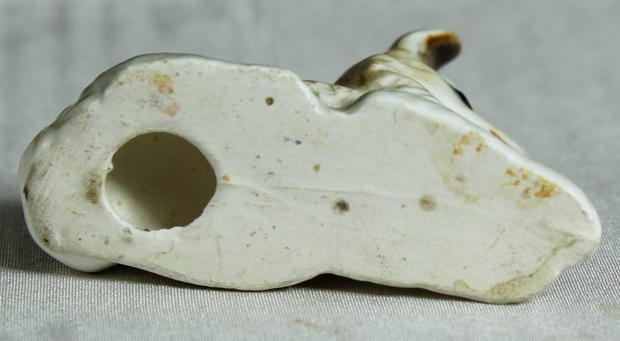 Miniature doe laying down