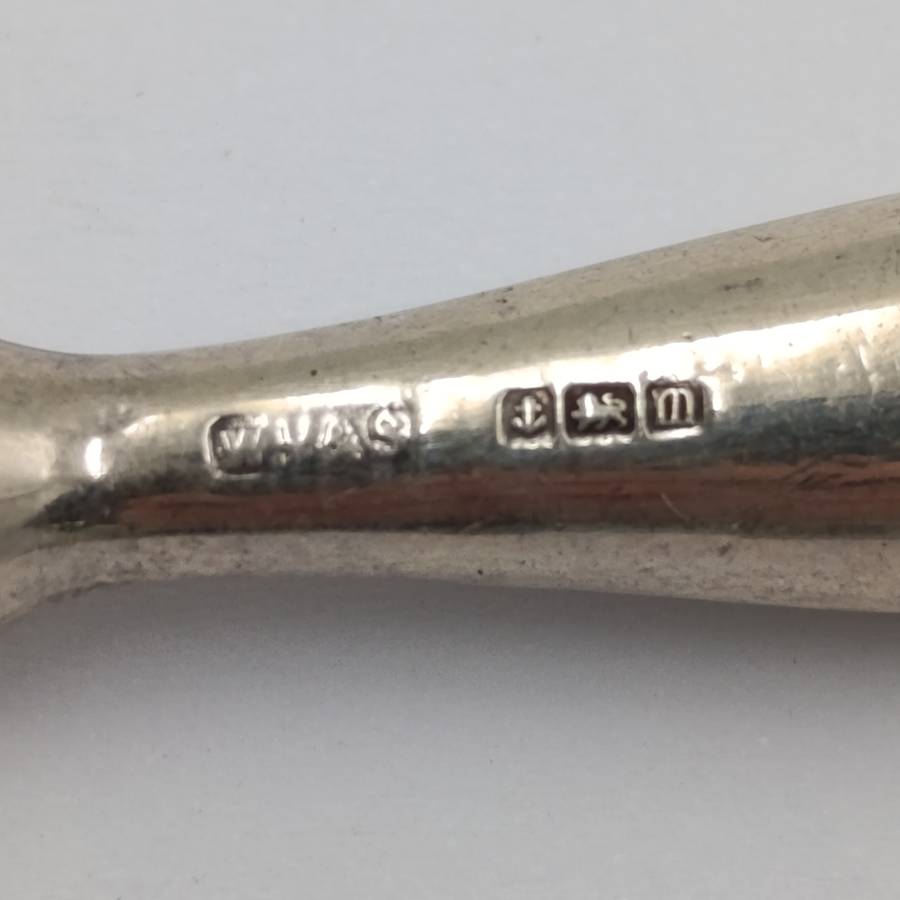 Antique tweezers with hallmarked sterling silver handle