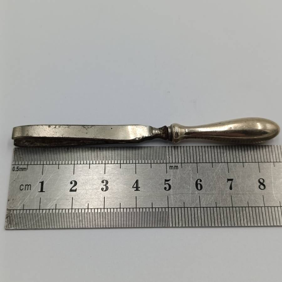 Antique tweezers with hallmarked sterling silver handle