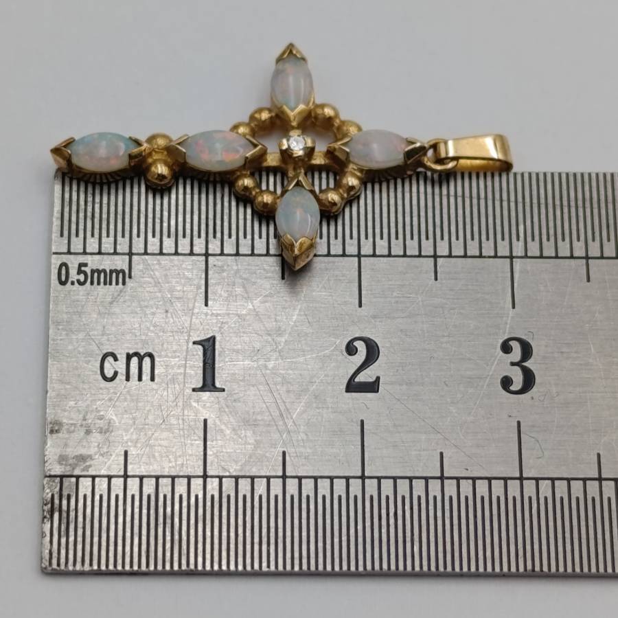 9kt Gold cross pendant with opals and small diamond - weighs 1.3g