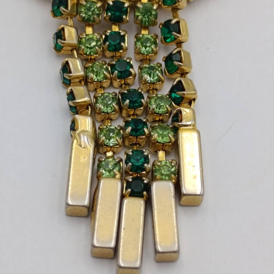 Vintage gold color & green stone brooch
