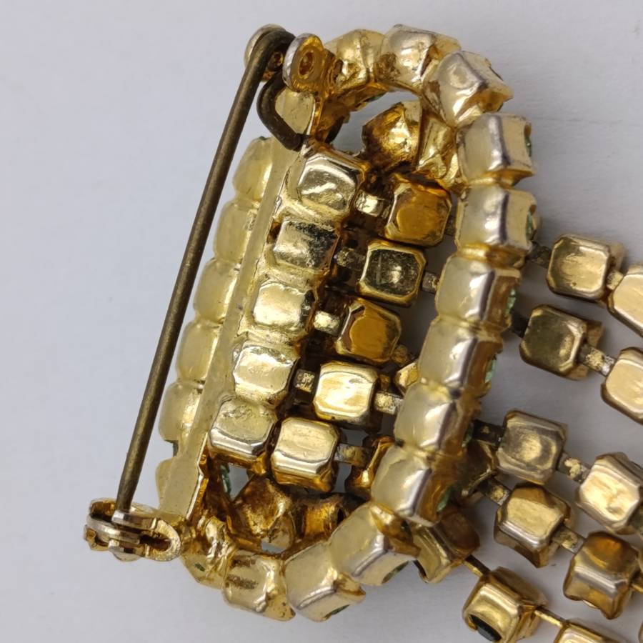 Vintage gold color & green stone brooch