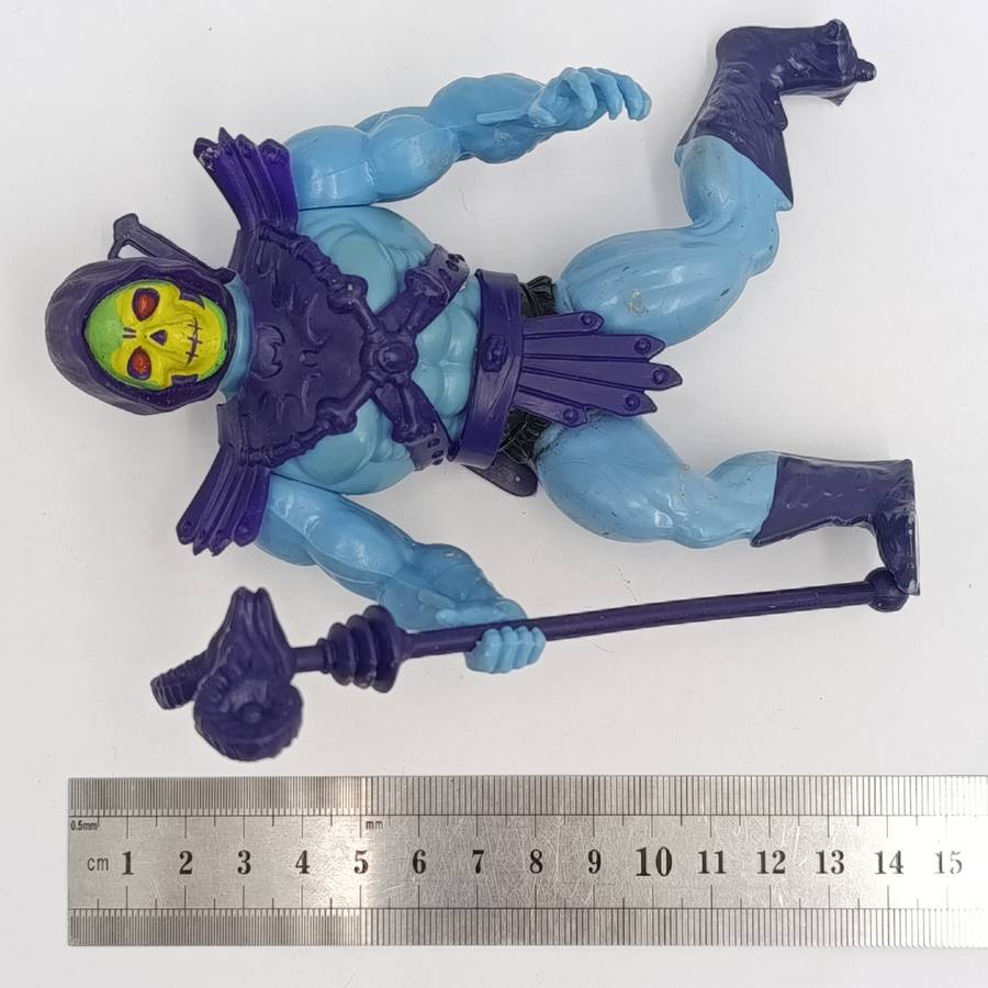 Vintage Masters of the Universe Skeletor figurine with weapons and accessories
