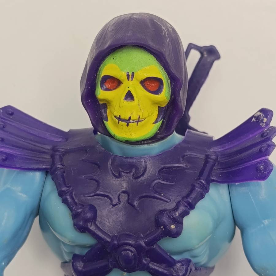 Vintage Masters of the Universe Skeletor figurine with weapons and accessories
