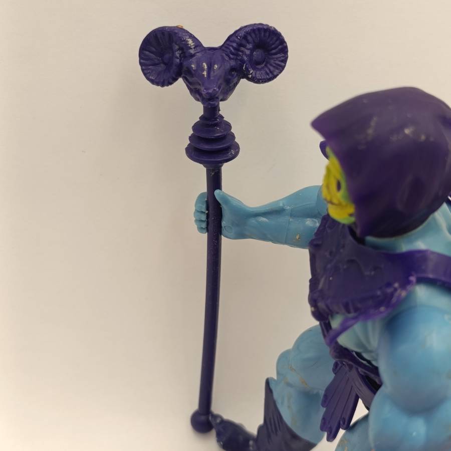 Vintage Masters of the Universe Skeletor figurine with weapons and accessories
