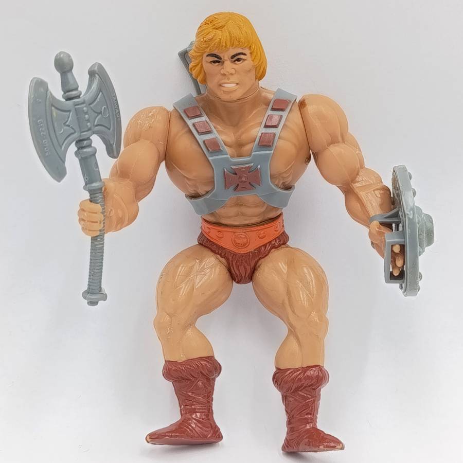 Vintage Masters of the Universe He-Man figurine with weapons and accessories