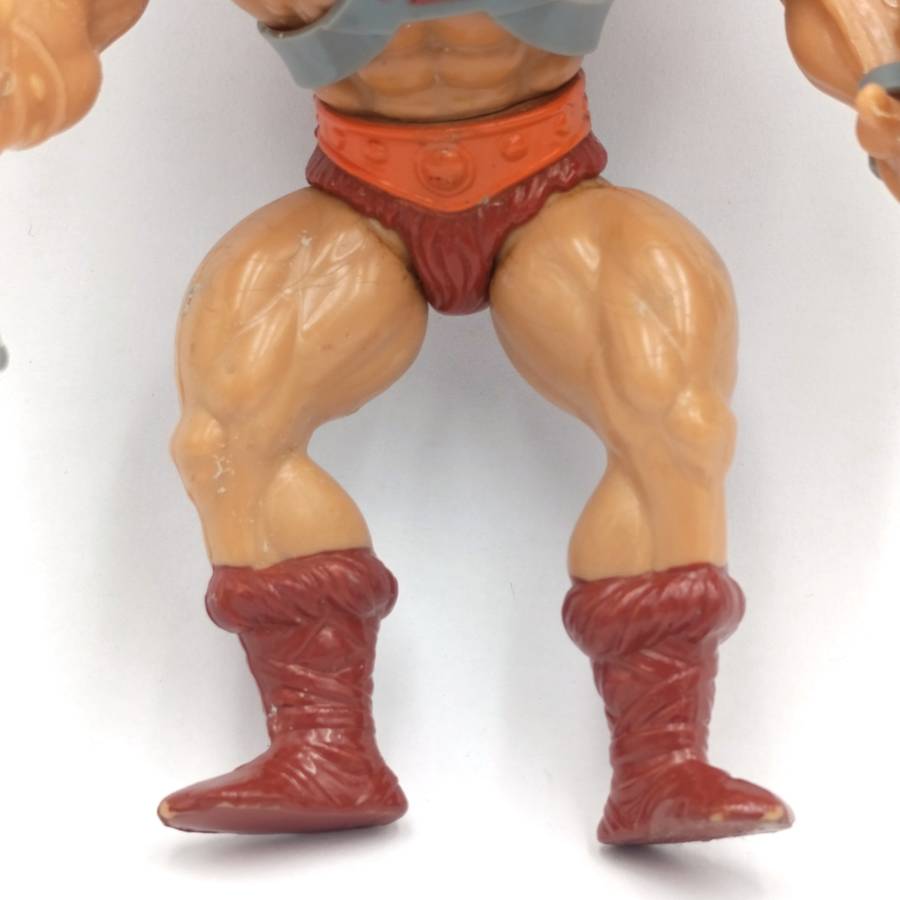 Vintage Masters of the Universe He-Man figurine with weapons and accessories