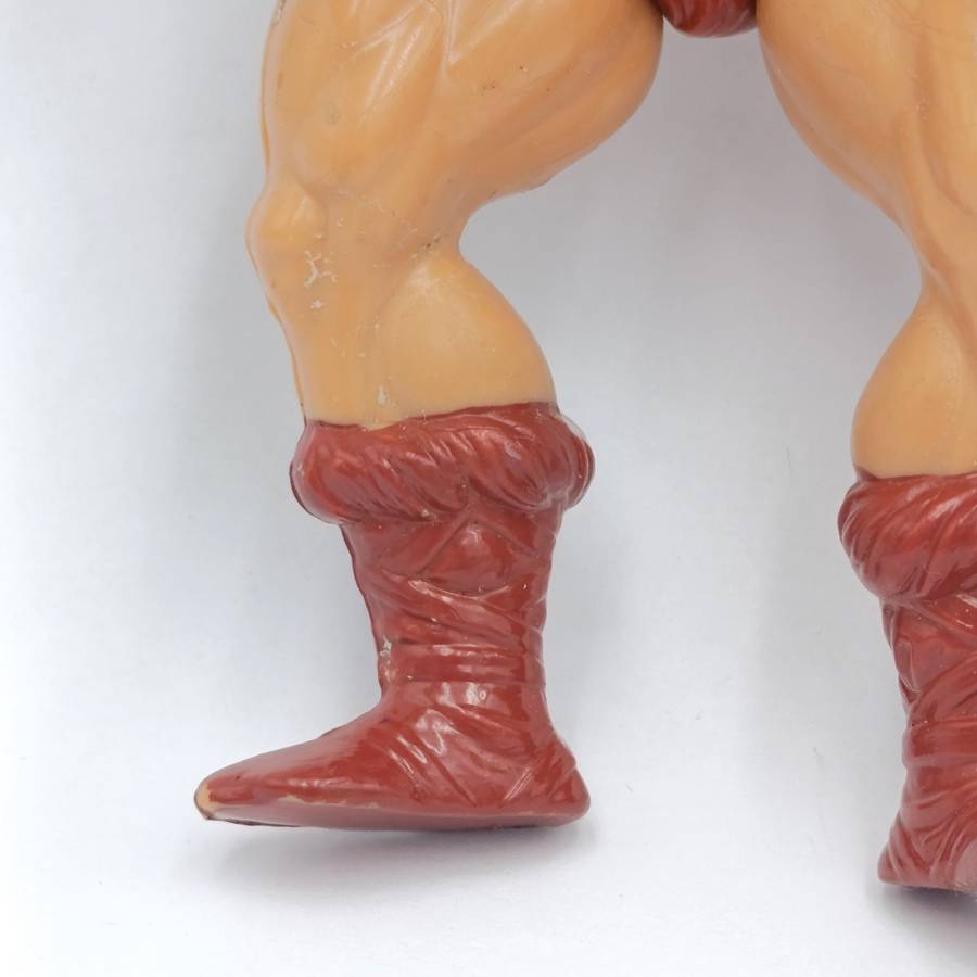 Vintage Masters of the Universe He-Man figurine with weapons and accessories