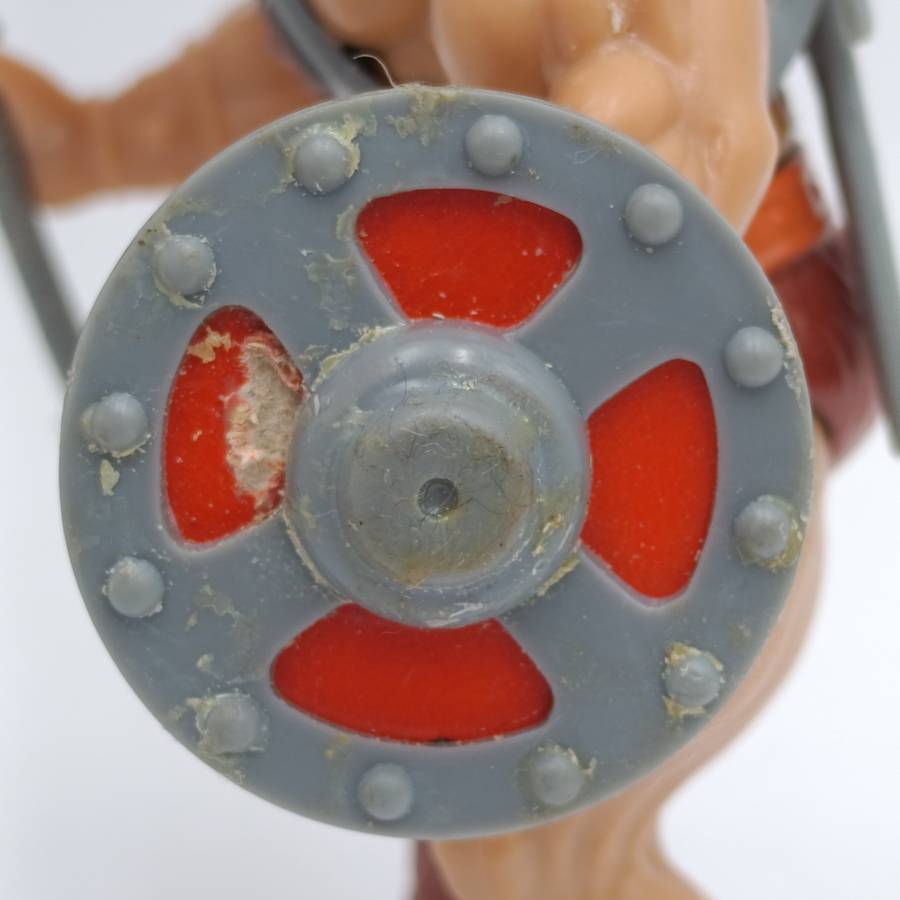 Vintage Masters of the Universe He-Man figurine with weapons and accessories