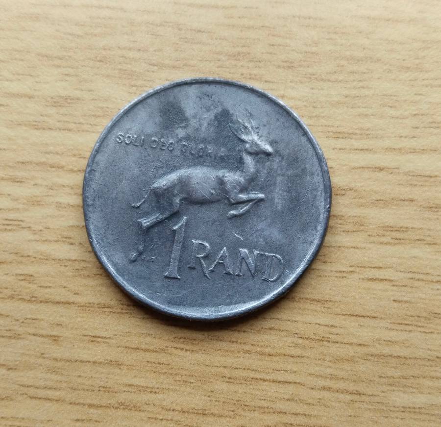 Error 1978 South Africa one rand. Looks like lead.