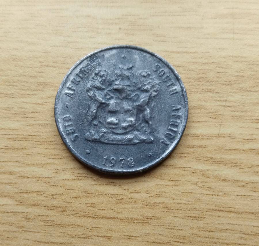 Error 1978 South Africa one rand. Looks like lead.