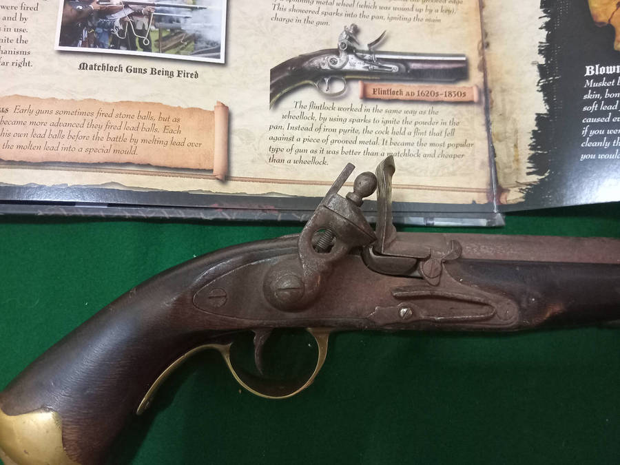 Antique flint lock pistol, original, made from solid heavy wood