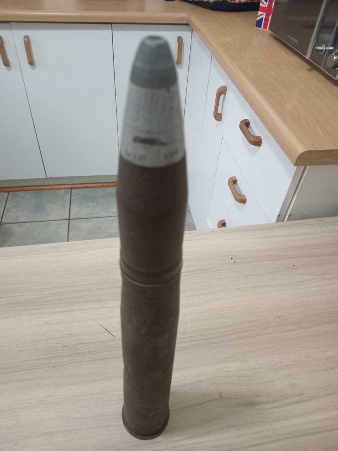 Artillery shell casing with head projectile (empty, used)