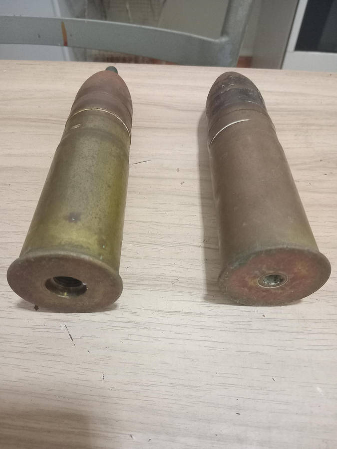 Two used German brass souvenir war bullets with projectile heads