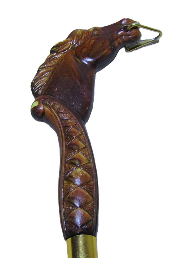 Vintage early plastic horse head shoe horn