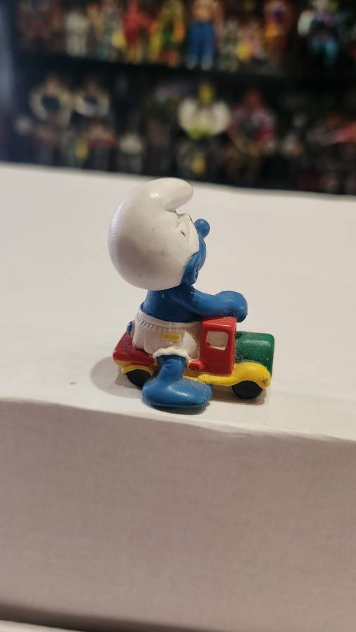 1996 Vintage Peyo Baby Smurf Riding Car