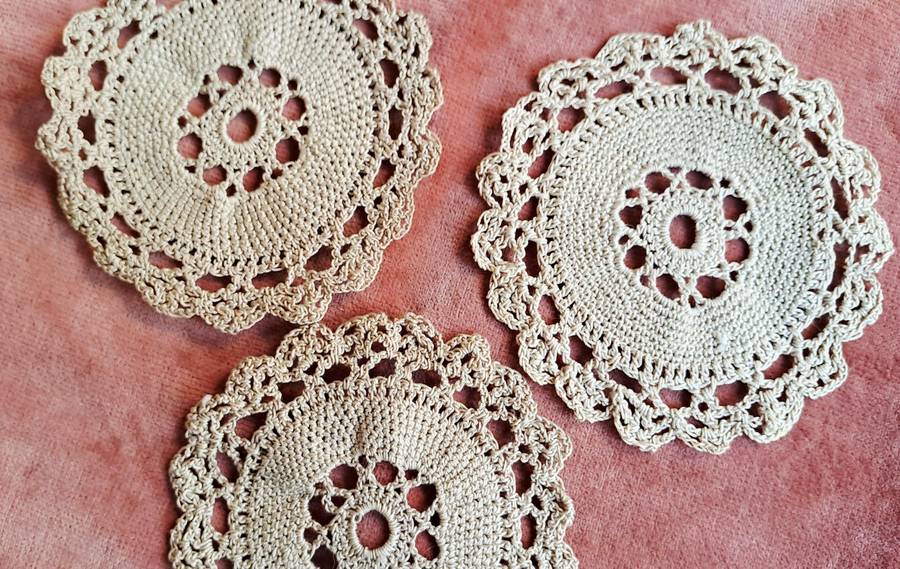 Three small ecru doilies 9 cm