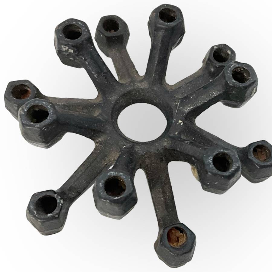 Three different styles of lighting- brass candlestick, Danish candleholder, modern floral tea light