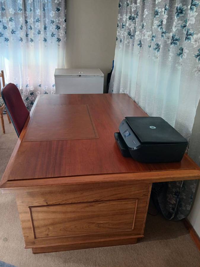 Wooden Executive Partner's Desk With A Leather Inlay Top And Multiple Drawers