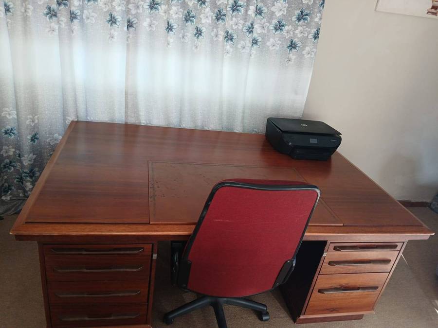 Wooden Executive Partner's Desk With A Leather Inlay Top And Multiple Drawers