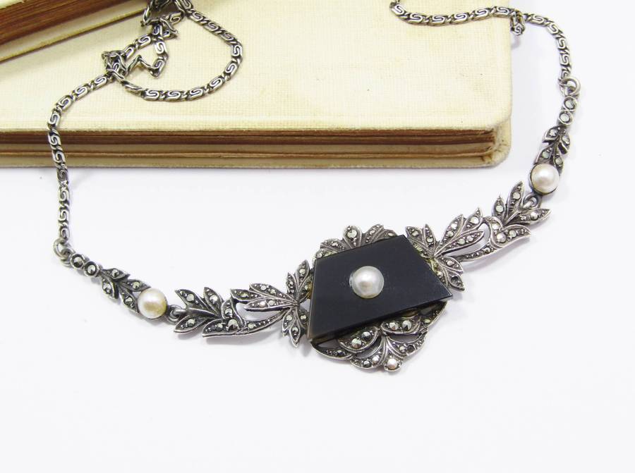 A Gorgeous Vintage Design Onyx Set with a Cultured Pearl Dotted with Marcasite's in 935 Silver