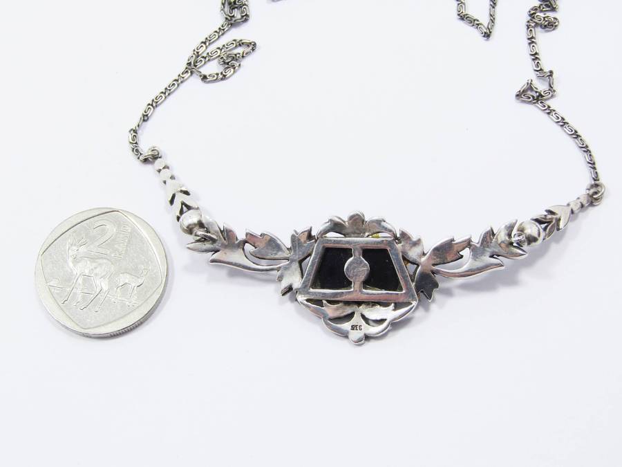 A Gorgeous Vintage Design Onyx Set with a Cultured Pearl Dotted with Marcasite's in 935 Silver